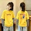 Nueva camiseta de estilo coreano para niñas, imitación de dos piezas, manga larga, camiseta básica de algodón puro para otoño, top versátil y elegante a la moda para niñas