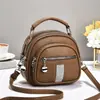 Bolso de mujer 2026 nuevo modelo multibolsillos con cremallera, bolso de mano redondo pequeño, simple y versátil para ir al trabajo, bolso de hombro y cruzado