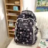 Mochila Escolar para Meninas do Ensino Fundamental 2024 Verão Novo Estilo Mochila Estampada para Alunos do Ensino Médio e Universitário Versátil Mochila para Notebook de Grande Capacidade