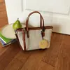 Bolsa de Gran Capacidad Estilo Coreano Transfronteriza para Mujer Verano 2026 Nuevo Bolso Tejido Pequeño de Nicho Bolso Cubo de Moda Elegante para Vacaciones