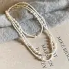 Collar de Perlas Apiladas Blanco de Alta Gama Cadena de Suéter Elegante Retro Francés Versátil para Otoño e Invierno