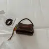 2026 Início do Outono Nova Bolsa Quadrada Pequena Estilosa Moda Nicho Alto Valor de Aparência Textura Personalidade Sensação Relaxada Bolsa de Ombro Único de Mão