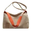 Bolsa vintage de grande capacidade para mulheres, novo modelo 2025, bolsa tote simples de lona para estudantes, bolsa de ombro e transversal para mulheres
