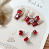 Joyería de diamantes para uñas al por mayor celebridad de internet Corazón Torcido lazo de cinta aleación tridimensional con incrustaciones de diamantes chica hot accesorios de Navidad y Año Nuevo
