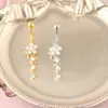 Europa y Estados Unidos comercio electrónico transfronterizo cobre incrustado circonita anillo para el ombligo flor incrustada circonita anillo para el ombligo colgante joyería para perforaciones al por mayor