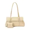 Bolso de axila de alta gama, nicho y sutilmente lujoso para mujer, con un nuevo diseño minimalista con patrón de lichi texturizado, estilo tote y correa para el hombro, perfecto para el día a día.