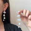 Pendientes coreanos elegantes y dulces, diseño de nicho elegante, flor pequeña, borla larga, lujo accesible, moda versátil para mujer