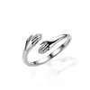 Anillo de Abrazo de Manos Fresco Versátil de Moda Amor de Pareja Abrazo Personalidad Creativa Abierto Ajustable Europeo y Americano