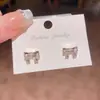 Brincos de laço doces e versáteis para mulheres, design de nicho, brincos de luxo de alta qualidade, acessórios de orelha modernos e elegantes para atacado