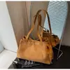 Bolso de mano elegante para mujer transfronterizo, nuevo modelo otoño 2026, bolso de mano para hombro o axila con un diseño único, adecuado para ir al trabajo