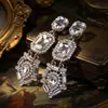 Pendientes de Borla de Gotas de Agua de Diamante Super Flash Pendientes de Botón de Lujo Ligero Exagerados de Nicho de Alta Gama Pendientes de Moda Elegantes para Mujer