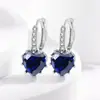 Comercio electrónico transfronterizo venta de exquisitos pendientes de moda amor color tesoro hebilla de oreja estilo reina diosa joyería de oreja fabricantes al por mayor