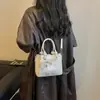 Bolso pequeño súper popular para el trabajo, nuevo de verano 2026 para mujer, patrón tejido de nicho, bolso cruzado de hombro único tipo cubo