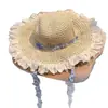 Sombrero de paja tejido con encaje de cinta estilo rústico para mujer, sombrero de sol de paja de ala ancha hueco para el verano en la playa junto al mar