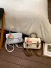 Bolsa Pequena Simples de Mão Estilo Coreano para Mulheres 2026 Nova Versátil Moda Bolsa Cambridge Nicho Elegante Bolsa Transversal para o Dia a Dia