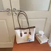 Bolso de mujer de gran capacidad 2026 primavera-verano nuevo casual de alta gama para estudiante bolso de hombro versátil bolsa de mano para commuting