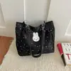 A bolsa tote doce popular deste ano para mulheres é o novo modelo de outono de 2026 com enfeites de estrela, adequada para o trabalho e como bolsa de ombro.