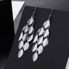 Aretes europeos y americanos transfronterizos moda una variedad de aretes de borla exagerados de metal modernos temperamento largos elementos populares aretes colgantes