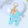 Chaveiro de Resina Azul Transparente com Letra Fresco e Simples com Pingente de Céu Azul e Nuvens Chaveiro para Bolsas Femininas