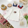 Camiseta de manga larga con estampado de dibujos animados para niños, con cuello semi-alto, adecuada para usar en capas en otoño, ropa infantil al por mayor