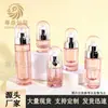 En stock Frasco dispensador de vidrio de doble capa con carcasa transparente para cuidado de la piel 20-100 ml Alta apariencia Frasco dispensador tipo prensa Material de embalaje para esencia