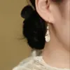 2024 Novo Estilo Quente Brincos Geométricos de Losango Olho de Gato de Alta Qualidade Luxo Acessível Nicho Elegante Popular Simples