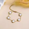 Pulseira de Trevo Popular Transfronteiriça de Aço Inoxidável Dupla Face Brilhante Moda Trevo de Quatro Folhas de Madrepérola Dourado 18K Pulseira