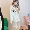 Conjunto de pijama con un lindo bordado de pingüino y diseño a rayas, adecuado para mujeres en primavera y otoño, con mangas largas y pantalones largos, y se puede usar como ropa de estar en casa.