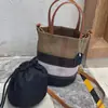 Bolso Cubo de Retazos de Cuero Genuino Rayado de Diseño de Nicho para Mujer 2026 Nueva Moda Clásico de Hombro Único Casual Versátil