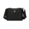 Bolsa de Ombro Simples com Armazenamento em Camadas para Mulheres 2026 Nova Bolsa Transversal de Nylon de Grande Capacidade Estilo Coreano Casual Tendência