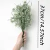 Manojo de enredaderas artificiales integradas de eucalipto y flor de camelia al por mayor para fabricantes transfronterizos, para colgar en la pared, decoración de pared verde y arreglos florales para vallas