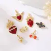 Moda europea y americana transfronteriza 14K oro real alas de amor hongo lazo collar colgante circón accesorios de joyería diy