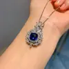 Nuevo conjunto de joyería de pendientes colgantes de lujo incrustados de diamantes azul zafiro retro estilo europeo y americano para mujer