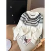 Cárdigan de lana suave y elegante con un aire retro nórdico, con un patrón jacquard Fair Isle, cuello redondo y longitud corta para mujer