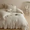 Juego de ropa de cama para niña estilo francés de cuatro piezas, tejido gofrado, mezcla de algodón y lino, funda nórdica con ribete de encaje, con un ambiente relajado