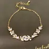 Pulsera de flor con circonita cúbica ultra brillante, chapada en oro real de 18 quilates, una pieza de joyería lujosa y de alta gama con un diseño vintage y exquisito