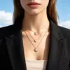 Venta al por mayor de collares colgantes de oro de estilo retro europeo y americano, multicapa, creativos, minimalistas, con forma de estrella, luna y corazón