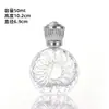 Botella de perfume más vendida con patrones creativos de alta gama, botella de vidrio transparente con spray de presión, botella dispensadora de cosméticos portátil