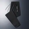 Pantalones de seda de hielo nuevos de verano 2025 para hombre, finos, de secado rápido, con pierna especial, sueltos y rectos, para hombre.