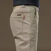 Pantalones de trabajo versátiles para hombre, corte slim, nuevos para otoño/invierno, pierna recta, corte holgado, casual y duraderos, largos