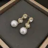 Pendientes de Perla de Circonita de Moda de Aguja Plateada Pendientes de Botón Retro de Lujo Ligero de Nicho Francés Pendientes Nuevos 2026
