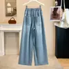 Foto real de pantalones de mezclilla Tencel de color claro talla grande para mujer, estilo de verano fino, frescos al tacto, cintura elástica, corte holgado, con caída, pantalones largos hasta el suelo para mujer
