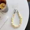 Correa de muñeca de seda plisada de alta calidad estilo nicho, nuevo colgante para funda de teléfono móvil, bolsa corta de red para regalo