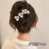 Elegante pinza para el pelo con giro floral que no daña la cabeza, nuevo modelo 2026 para la parte trasera de la cabeza de mujer, pasador de alta gama