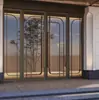 Puerta de entrada de diseño de vidrio de acero inoxidable de alta gama personalizada, puerta de entrada corredera de hotel, puerta de vidrio de acero inoxidable con resorte de piso