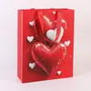 En Stock Estilo Nuevo Sin Cintura Bolsillo Tipo Bolsa de Papel Corazón Rojo Simple de Alta Gama Bolsa de Mano de Papel para Ropa Bolsa de Compras para Cosméticos
