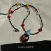 ¡¡¡Súper lindo!!! Collar Colgante Perro Globo M&M Rojo para Mujer, Nuevo Accesorio de Cadena para Suéter de Alta Gama Otoño e Invierno 2025