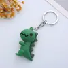 Llavero de Dinosaurio Lindo Colgante de Bolsa de Dinosaurio con Ojos Lindos Muñeco de Gominola Creativo que Cuelga Regalo Máquina Gashapon Muñeco de Máquina de Garra