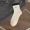 Novedad de principios de otoño, calcetines de media pantorrilla versátiles para todas las estaciones con lazo de lunares, calcetines de algodón simples y modernos para mujer, calcetines para estudiantes