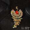 Broche de pavo real anti-luz transfronterizo entre Europa y Estados Unidos, broche, accesorios de ropa de diamantes de imitación de alta calidad, broche vintage de fénix